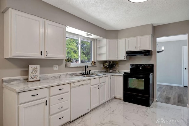 kitchen with black electric range oven, sink, white dishwasher, a textured ceiling, and white cabinets