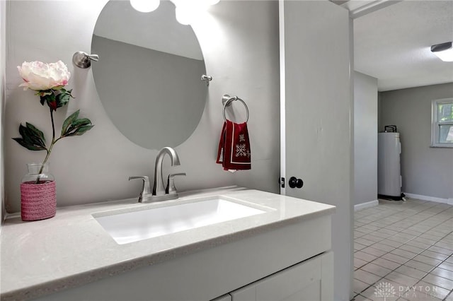 bathroom with vanity, tile patterned floors, and water heater