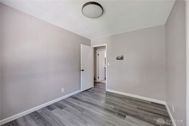 spare room featuring hardwood / wood-style flooring