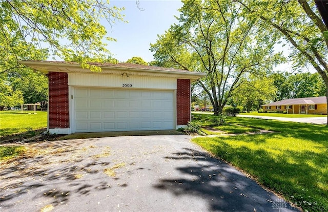 garage with a lawn