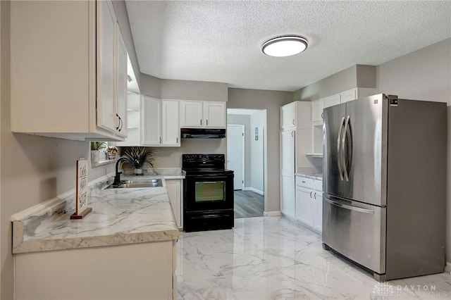 kitchen with black electric range oven, sink, white cabinetry, a textured ceiling, and stainless steel refrigerator