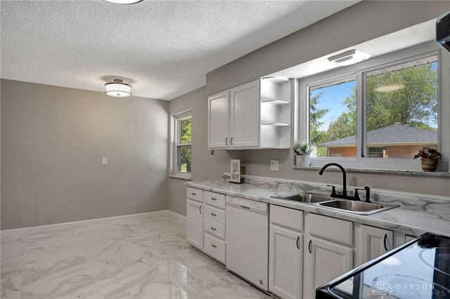 kitchen featuring sink, white cabinetry, white dishwasher, light stone countertops, and stove