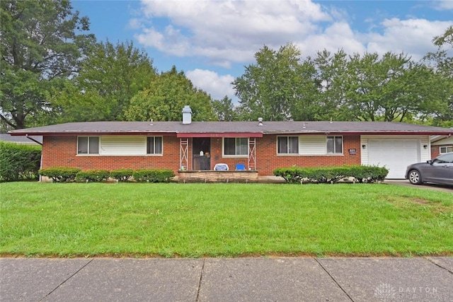 ranch-style house with a front lawn, brick siding, a garage, and a chimney