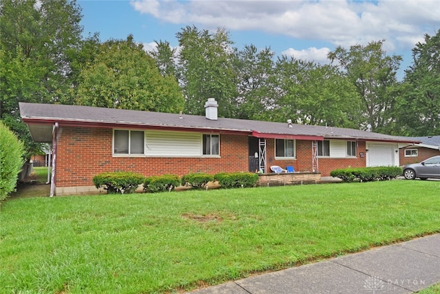 single story home featuring a front lawn and a garage