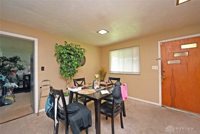 dining room with light carpet