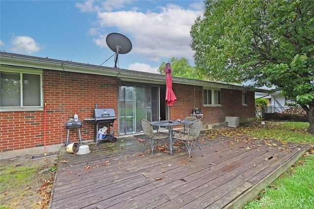 wooden deck featuring grilling area