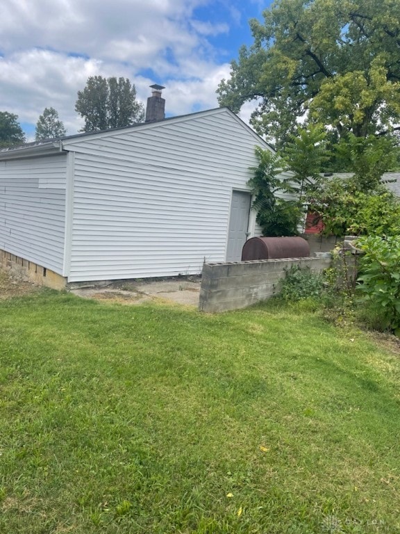 view of property exterior with a lawn