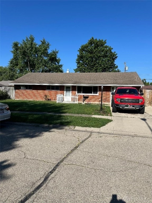 ranch-style house with a front lawn