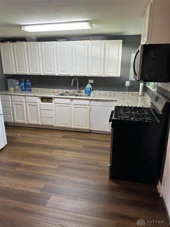 kitchen with sink, wood-type flooring, black stove, dishwasher, and white cabinetry