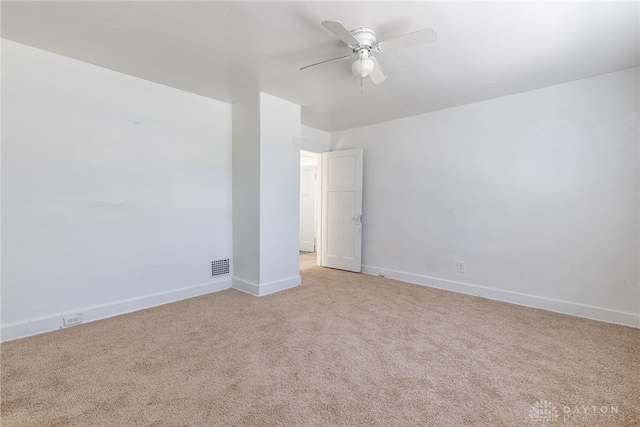 unfurnished room with light carpet and ceiling fan