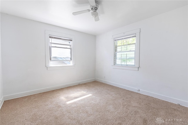 carpeted empty room with ceiling fan