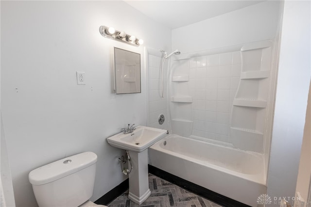 full bathroom featuring toilet, sink, and tub / shower combination