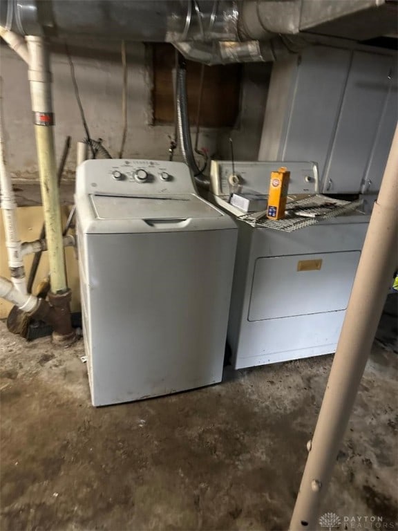 laundry room with washing machine and clothes dryer and laundry area