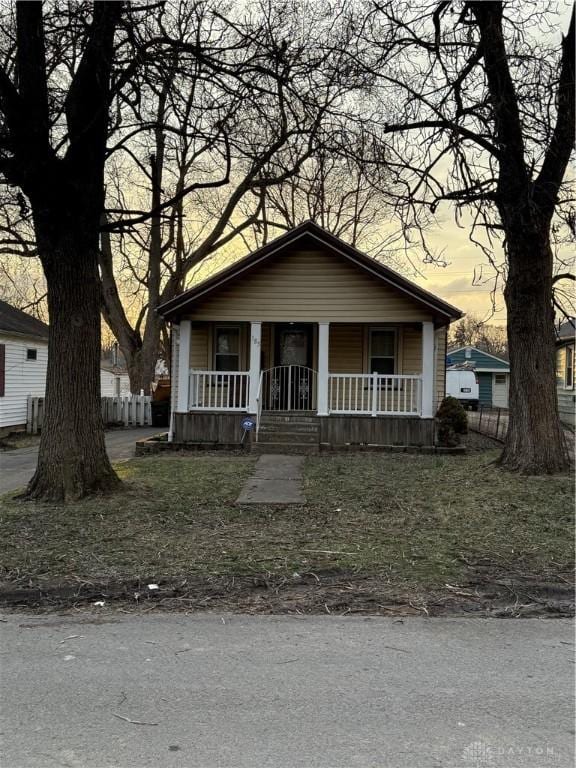 bungalow-style house featuring covered porch