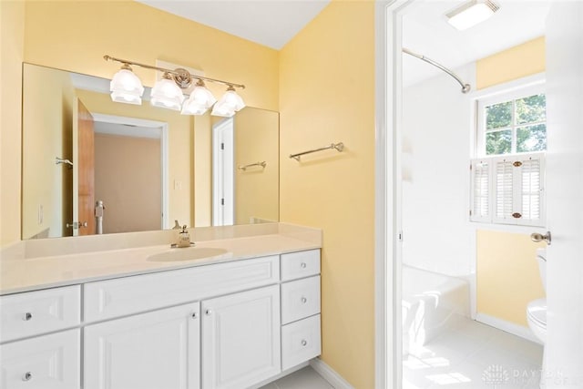 full bathroom with visible vents, baseboards, toilet, vanity, and shower / washtub combination