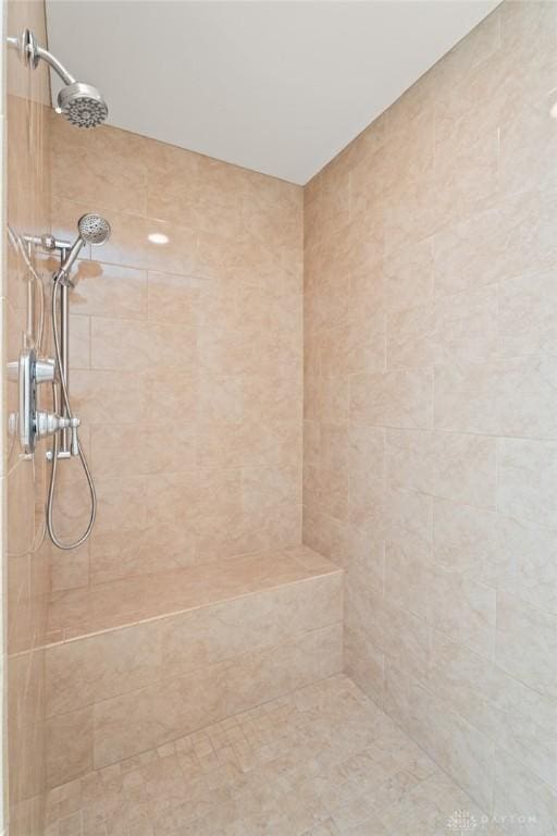 bathroom with a tile shower