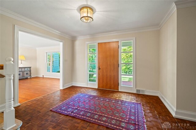 doorway to outside with ornamental molding