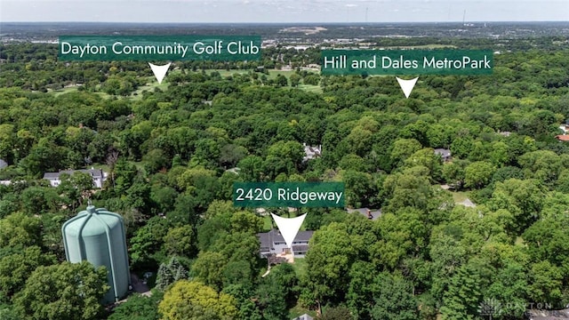 birds eye view of property with a forest view