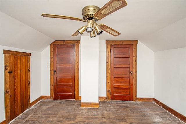 additional living space featuring ceiling fan, dark wood-type flooring, and vaulted ceiling