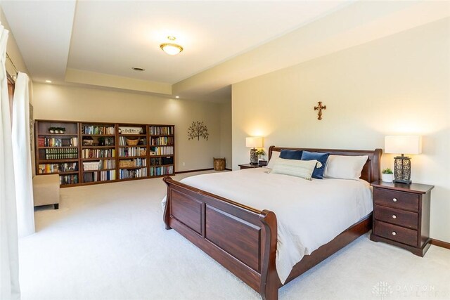 bedroom with light colored carpet