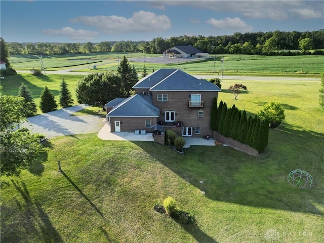 birds eye view of property with a rural view