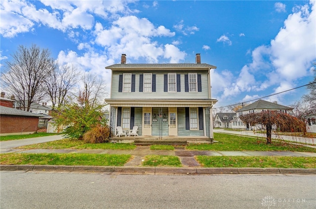 view of front of property featuring covered porch