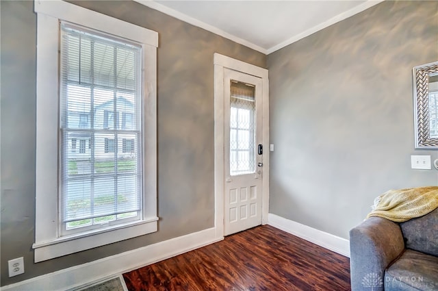 entryway with hardwood / wood-style flooring and crown molding