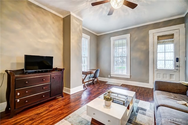 living room featuring ceiling fan, hardwood / wood-style floors, and crown molding