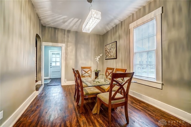 dining space with dark wood-type flooring