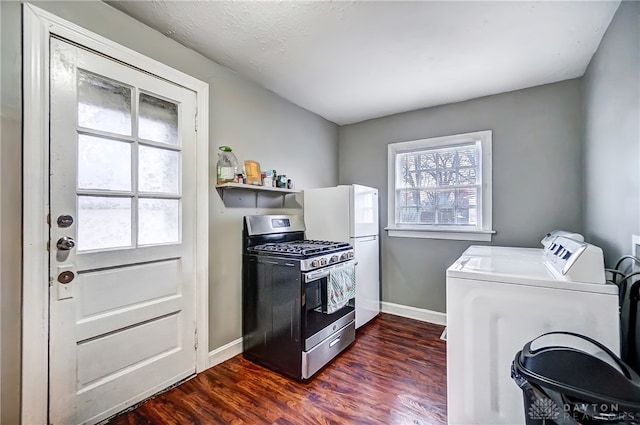 kitchen with washer and dryer, stainless steel gas range, dark wood-type flooring, and white fridge