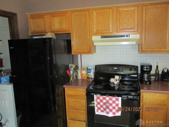 kitchen featuring decorative backsplash and black appliances