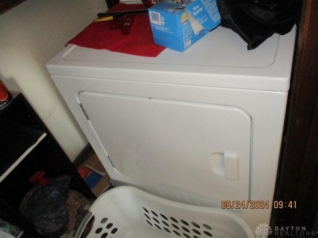 clothes washing area featuring washer / clothes dryer