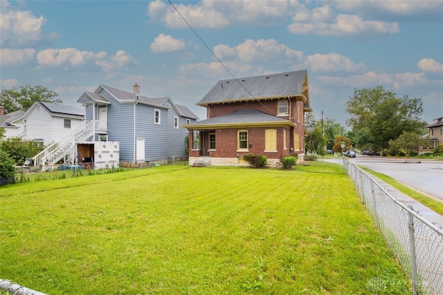 back of house with a yard