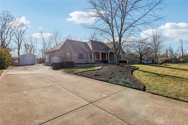 single story home featuring a front lawn and a shed