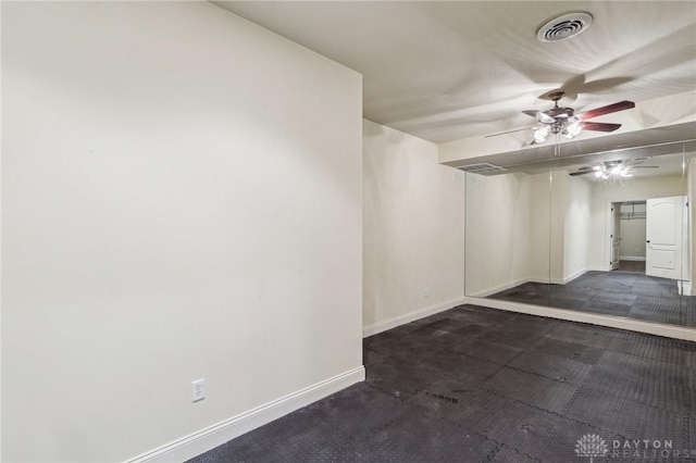 spare room with ceiling fan