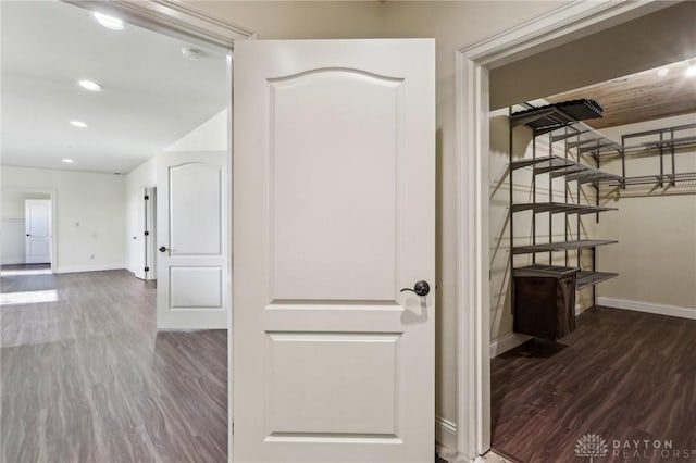 hallway featuring dark wood-type flooring