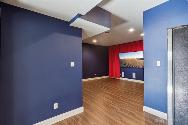 unfurnished room featuring hardwood / wood-style flooring