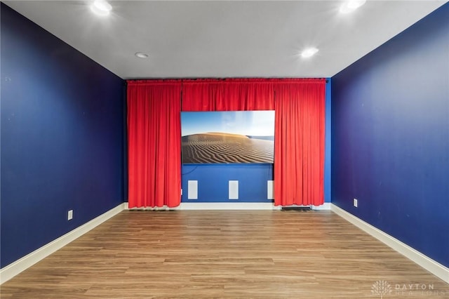 spare room featuring wood-type flooring