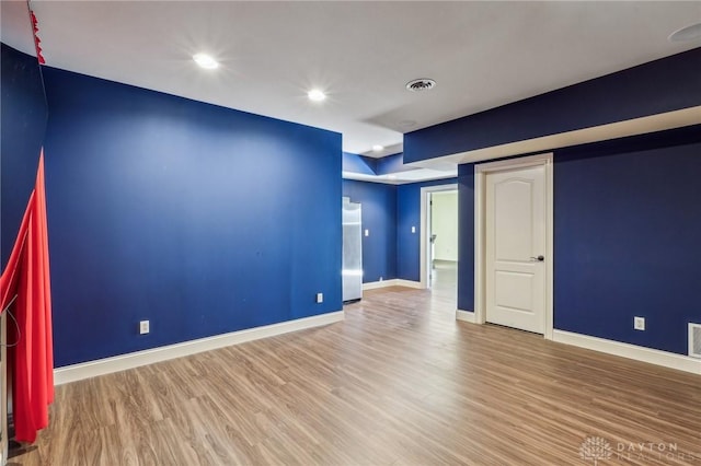 unfurnished room featuring light hardwood / wood-style floors