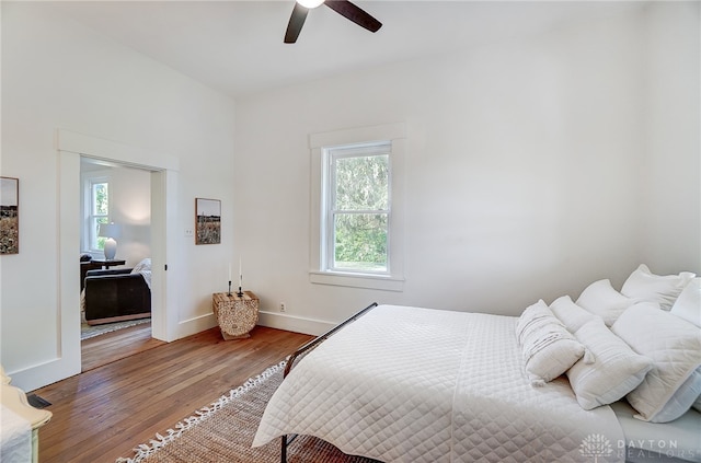 bedroom featuring ceiling fan and hardwood / wood-style floors