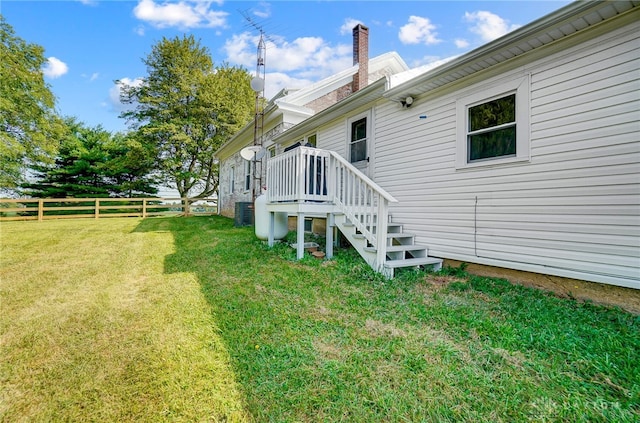 view of yard with central AC