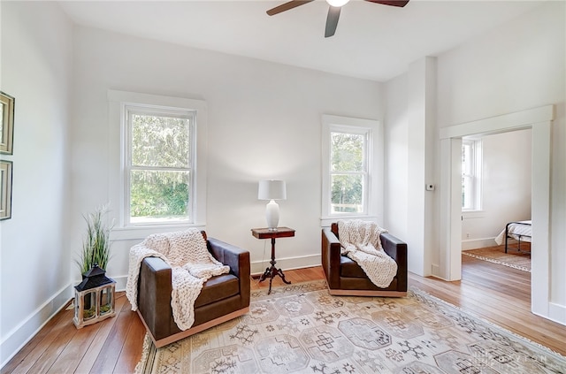 sitting room with a healthy amount of sunlight and light hardwood / wood-style floors