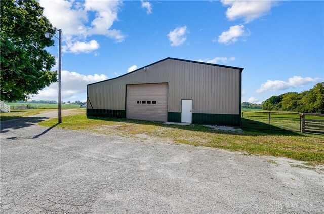 garage featuring a rural view