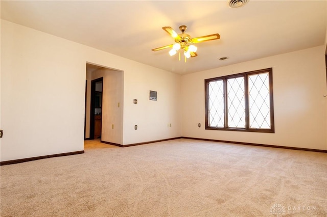 carpeted empty room with ceiling fan