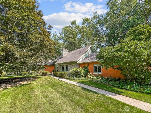 view of front of home with a front yard