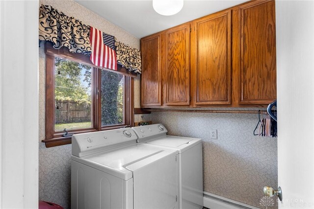 laundry room featuring cabinets and independent washer and dryer