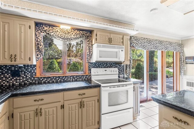 kitchen featuring white appliances, backsplash, ornamental molding, and light tile patterned flooring