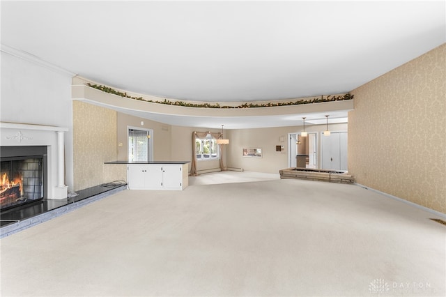 unfurnished living room with carpet