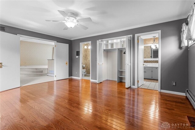 unfurnished bedroom with crown molding, connected bathroom, ceiling fan, and tile patterned floors