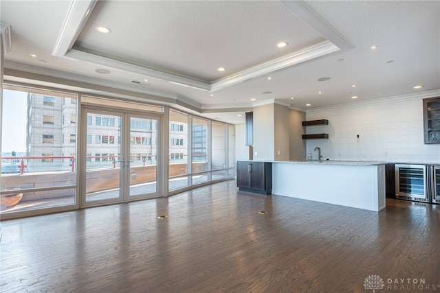 interior space featuring a view of city, indoor wet bar, and a sink